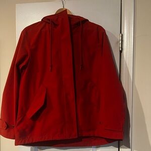 Orange rain coat from Uniqlo (worn)